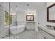 Elegant bathroom features a soaking tub, glass shower, and double vanity with granite countertops at 5301 Regency Lake Ct, Sugar Hill, GA 30518