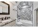 Bathroom featuring a tub and shower, granite countertops, and modern finishes at 5301 Regency Lake Ct, Sugar Hill, GA 30518