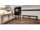 Stylish entryway featuring dark accent wall, hardwood flooring, and elegant decor at 5301 Regency Lake Ct, Sugar Hill, GA 30518