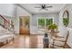 Bright foyer with hardwood floors, staircase, and natural light, creating an open and inviting space at 5301 Regency Lake Ct, Sugar Hill, GA 30518