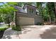 Detached two-car garage with an upstairs, featuring a clean facade and well-maintained driveway at 5301 Regency Lake Ct, Sugar Hill, GA 30518