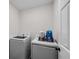 Efficient laundry area with modern washer and dryer ready for your convenience at 5301 Regency Lake Ct, Sugar Hill, GA 30518