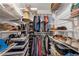 Organized walk-in closet featuring shelving, hanging racks, and ample storage space at 5301 Regency Lake Ct, Sugar Hill, GA 30518