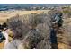 Aerial view of a home secluded with many bare trees in a well developed neighborhood at 6170 Wellington Ct, Cumming, GA 30040
