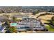 Aerial photograph featuring a community area with ample parking, swimming pool, and a decorative pond at 6170 Wellington Ct, Cumming, GA 30040