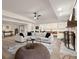 Spacious basement featuring a stone fireplace, open layout, and laminate wood flooring at 6170 Wellington Ct, Cumming, GA 30040