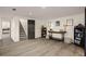 Finished basement with hardwood floors and staircase leading to the floor above at 6170 Wellington Ct, Cumming, GA 30040