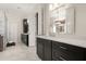 Spacious bathroom boasts marble floors, dual vanities, and a glass-enclosed shower at 6170 Wellington Ct, Cumming, GA 30040