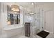Bright bathroom featuring a soaking tub, a glass shower, and elegant marble countertops at 6170 Wellington Ct, Cumming, GA 30040