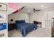 Inviting bedroom with Americana decor, featuring ample space, a ceiling fan, and neutral carpet at 6170 Wellington Ct, Cumming, GA 30040