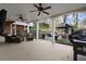 Spacious covered patio with ceiling fans and ample seating, ideal for outdoor living and entertaining at 6170 Wellington Ct, Cumming, GA 30040
