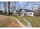 Beautifully landscaped home with a well-manicured lawn, stone retaining wall and lovely curb appeal at 6170 Wellington Ct, Cumming, GA 30040
