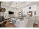 Elegant living room with coffered ceilings, hardwood floors, and ample seating at 6170 Wellington Ct, Cumming, GA 30040