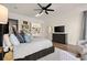 Bright bedroom showcasing a soft carpet, ceiling fan, and windows with natural light at 6170 Wellington Ct, Cumming, GA 30040