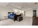 Large main bedroom with tray ceilings, neutral carpet, and a door leading to the ensuite bathroom at 6170 Wellington Ct, Cumming, GA 30040
