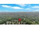 Aerial view of a home in a neighborhood, featuring a lush tree canopy and well-maintained properties at 123 Patrick Way, Marietta, GA 30064
