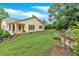 Home exterior with large, landscaped backyard, including lush grass and retaining walls at 123 Patrick Way, Marietta, GA 30064