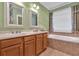 Bathroom featuring double vanity with mirrors and bathtub at 123 Patrick Way, Marietta, GA 30064