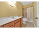 Bathroom features tiled floors, wood vanity, and shower-tub combination at 123 Patrick Way, Marietta, GA 30064