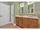 Bathroom featuring a double sink vanity and a white door at 123 Patrick Way, Marietta, GA 30064