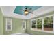 Bedroom with light green walls, blue ceiling inlay, and large windows offering ample natural light at 123 Patrick Way, Marietta, GA 30064