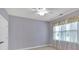 Bedroom with neutral carpet, a window with patterned curtain, and a ceiling fan at 123 Patrick Way, Marietta, GA 30064