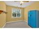 Bedroom with neutral carpet, a window overlooking the yard, and a blue storage cabinet at 123 Patrick Way, Marietta, GA 30064
