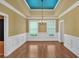 Dining room with tray ceilings, chandelier, wainscotting, and hardwood floors at 123 Patrick Way, Marietta, GA 30064