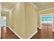 Hallway with hardwood floors, clean baseboards, and views into other rooms at 123 Patrick Way, Marietta, GA 30064