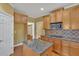 Modern kitchen with granite countertops, stainless microwave, and wood cabinets at 123 Patrick Way, Marietta, GA 30064