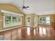 A spacious living room featuring lots of natural light, hardwood floors, and views of the backyard at 123 Patrick Way, Marietta, GA 30064