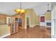 An open-concept room featuring hardwood floors, a fireplace, and stainless steel appliances at 123 Patrick Way, Marietta, GA 30064
