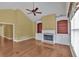 A living room showcasing hardwood floors, a fireplace, built-in bookshelves, and abundant natural light at 123 Patrick Way, Marietta, GA 30064
