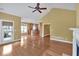 An open living area featuring hardwood floors, a fireplace, and an open concept to the kitchen at 123 Patrick Way, Marietta, GA 30064