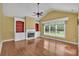 A living room with a fireplace, hardwood floors, vaulted ceilings, and built-in bookshelves at 123 Patrick Way, Marietta, GA 30064