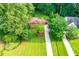 Aerial view of a charming single-story home with a well-manicured lawn and mature trees at 1706 Remington Rd, Atlanta, GA 30341