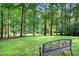 Serene backyard garden featuring a bench and lush green surroundings at 1706 Remington Rd, Atlanta, GA 30341