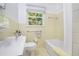 Bathroom showcasing classic tiling, neutral fixtures, and a shower-tub combo at 1706 Remington Rd, Atlanta, GA 30341