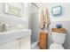 Bathroom featuring white fixtures, modern tiling, and a shower at 1706 Remington Rd, Atlanta, GA 30341