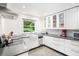 Modern kitchen with white cabinets, sleek countertops, and updated stainless steel appliances at 1706 Remington Rd, Atlanta, GA 30341