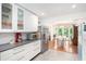 Open-concept kitchen featuring white cabinets, stainless steel appliances, and an eat-in dining space at 1706 Remington Rd, Atlanta, GA 30341