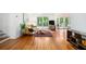 Bright living room featuring hardwood floors, large windows, and modern decor at 1706 Remington Rd, Atlanta, GA 30341