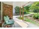 Cozy covered porch featuring comfortable green chairs, perfect for relaxing and enjoying the view at 1706 Remington Rd, Atlanta, GA 30341