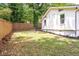 Backyard featuring a privacy fence and lush greenery, creating a serene outdoor space at 2294 Hill Nw St, Atlanta, GA 30318