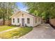 Beautiful single-story home with a concrete driveway and lush green lawn at 2294 Hill Nw St, Atlanta, GA 30318