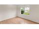 Bedroom with attractive wood-look flooring and a window offering outdoor views at 3599 Salem Glen Rd, Lithonia, GA 30038