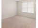 Inviting bedroom with neutral carpeting, natural light and a window that offers a peaceful view at 3599 Salem Glen Rd, Lithonia, GA 30038