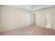 Spacious bedroom with neutral carpeting, a closet and a door to an ensuite bathroom at 3599 Salem Glen Rd, Lithonia, GA 30038