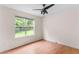 Inviting bedroom with attractive wood-look flooring, natural light, and a ceiling fan at 3599 Salem Glen Rd, Lithonia, GA 30038