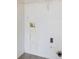Bright laundry room with hookups ready for washer and dryer installation and wire shelving for storage at 3599 Salem Glen Rd, Lithonia, GA 30038